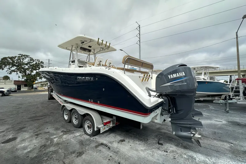Slide: The Image of 2007 Century 3200 Center Console boat with Yamaha outboard motor on a trailer. - 2