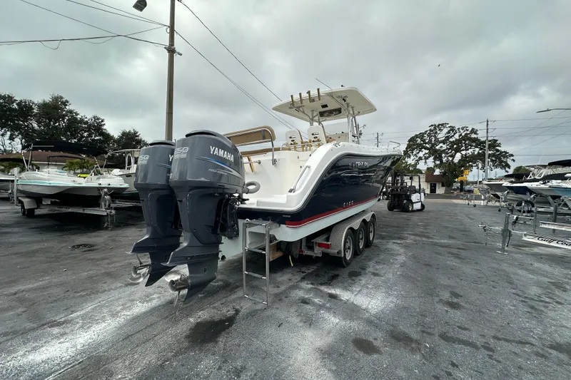 Slide: The Image of 2007 Century 3200 Center Console boat with dual Yamaha engines on a trailer. - 4