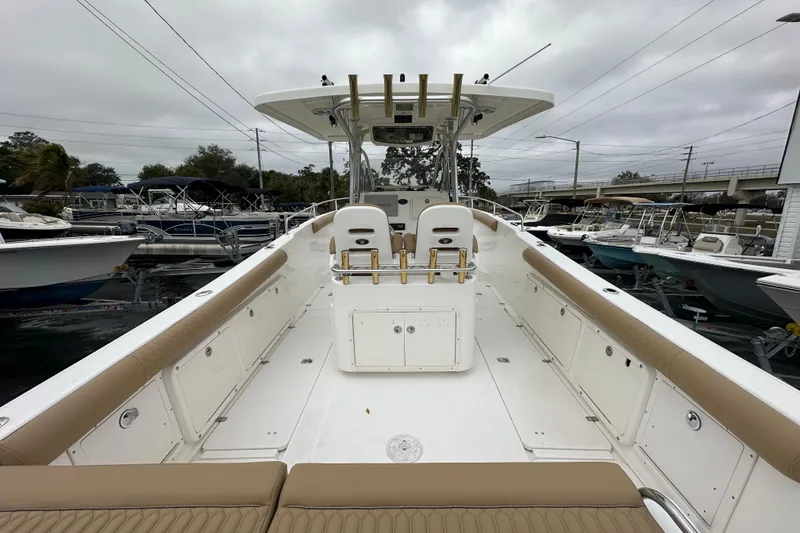 Slide: The Image of 2007 Century 3200 Center Console boat with spacious deck and seating, docked at marina. - 8