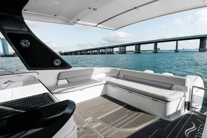 Slide: The Image of Azimut Verve 42 yacht interior, 2025 model, with ocean view and bridge in background. - 12