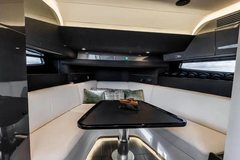 Slide: The Image of Luxurious interior of 2025 Azimut Verve 42 yacht with elegant seating and table. - 18