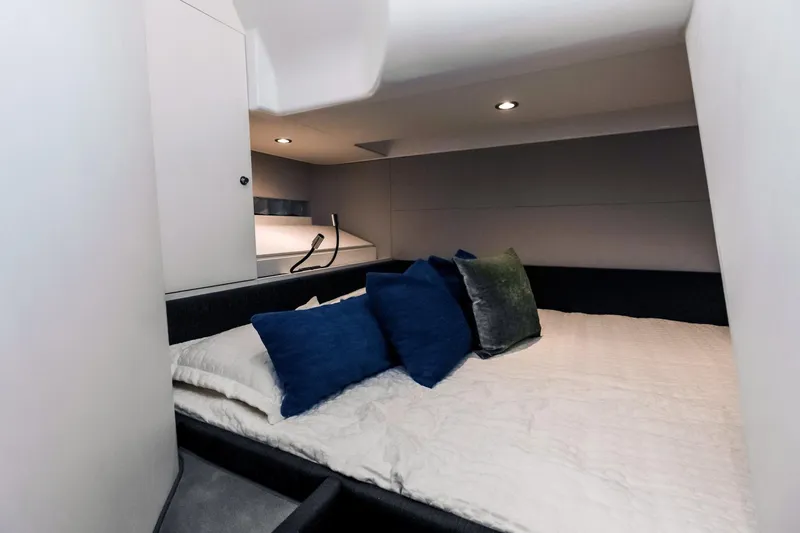Slide: The Image of Luxurious cabin interior of 2025 Azimut Verve 42 yacht with plush bedding. - 19