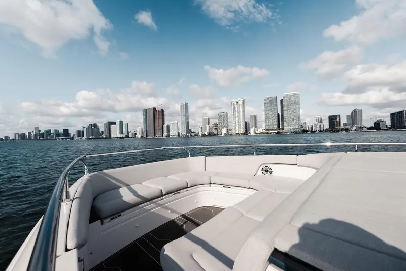 Slide: The Image of Azimut Verve 42 yacht cruising with city skyline in the background, 2025 model. - 8