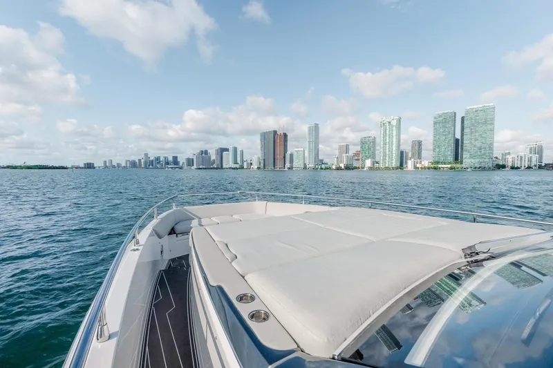 Slide: The Image of Azimut Verve 42 yacht cruising near city skyline, 2025 model. - 9