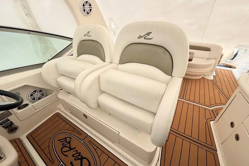 Slide: The Image of Luxurious interior of 2007 Sea Ray 340 Sundancer with plush seating and elegant flooring. - 10