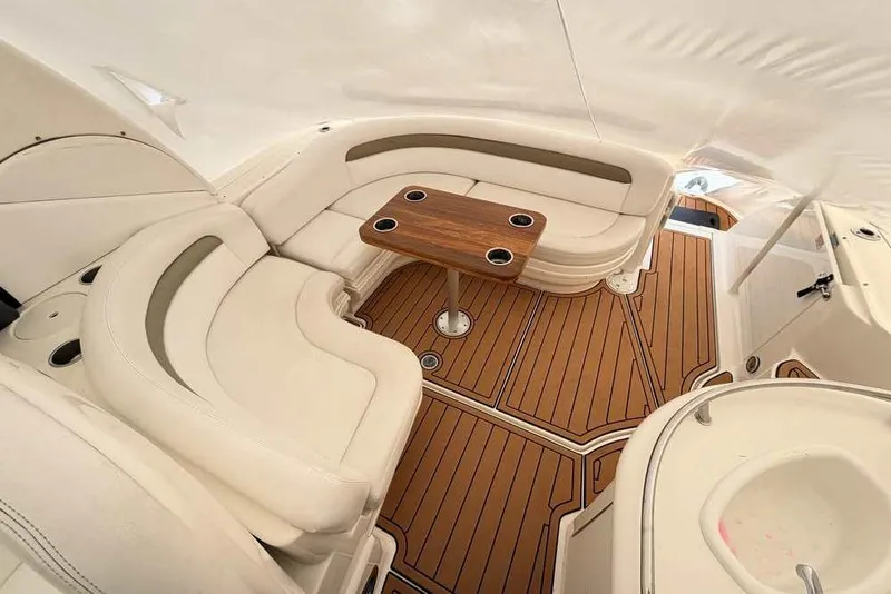 Slide: The Image of Luxurious 2007 Sea Ray 340 Sundancer interior with elegant seating and wooden table. - 12