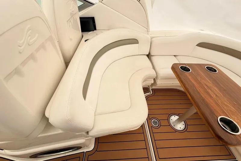 Slide: The Image of Luxurious seating area on a 2007 Sea Ray 340 Sundancer yacht with wooden table. - 16
