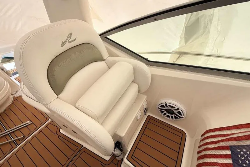 Slide: The Image of Captain's seat on 2007 Sea Ray 340 Sundancer with teak flooring and speaker. - 18