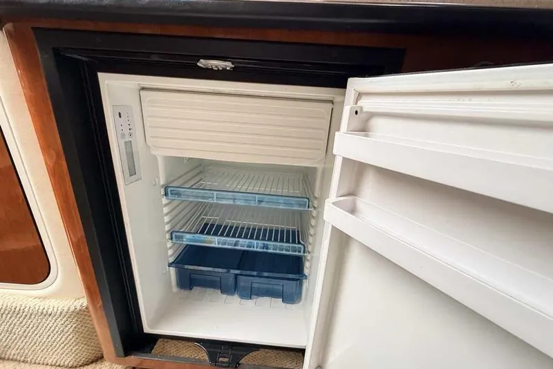 Slide: The Image of Open refrigerator inside a 2007 Sea Ray 340 Sundancer boat cabin. - 34