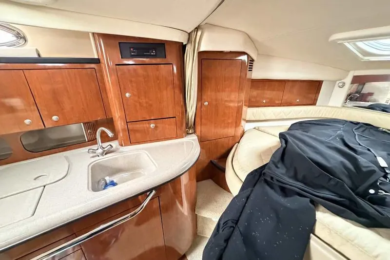 Slide: The Image of Luxurious interior of 2007 Sea Ray 340 Sundancer yacht with wood cabinetry and cozy seating. - 37