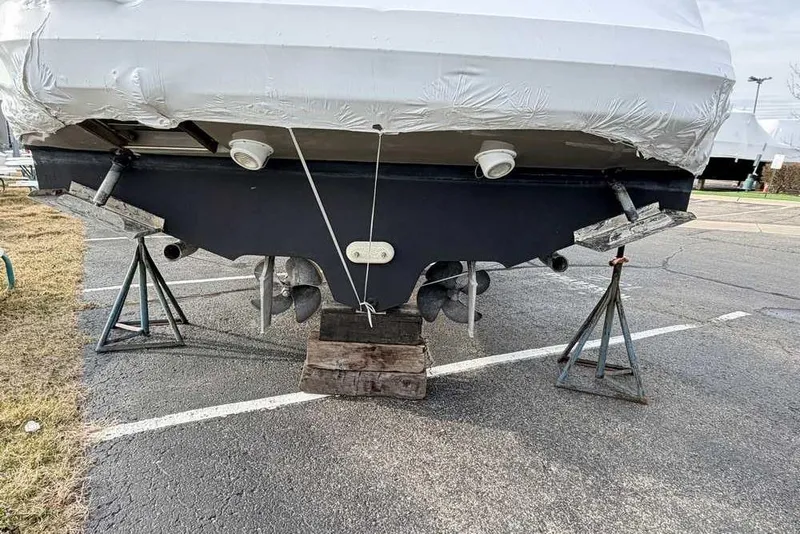 Slide: The Image of 2007 Sea Ray 340 Sundancer boat on stands, rear view, in a parking lot. - 44