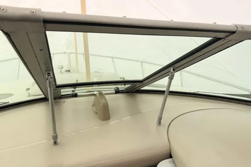 Slide: The Image of 2007 Sea Ray 340 Sundancer windshield view with open hatch and beige interior. - 5