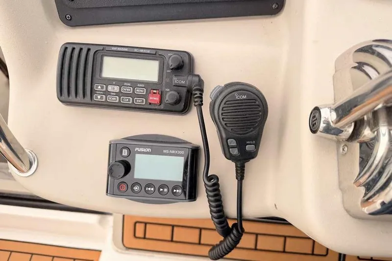 Slide: The Image of Control panel of a 2007 Sea Ray 340 Sundancer with radio and microphone. - 8