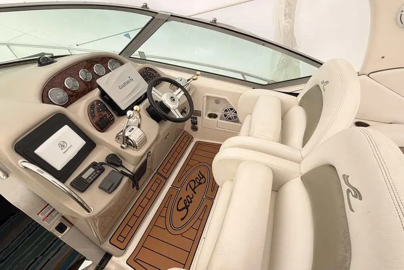 Slide: The Image of Luxurious 2007 Sea Ray 340 Sundancer cockpit with Garmin navigation and plush seating. - 9