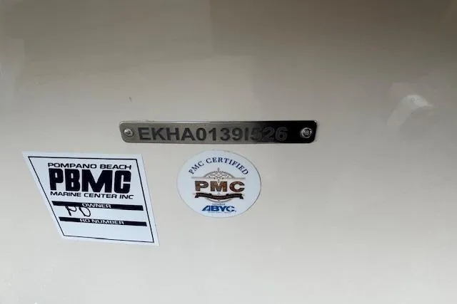 Slide: The Image of 2026 Carolina Skiff E24 DLX CC with certification and identification plates. - 3