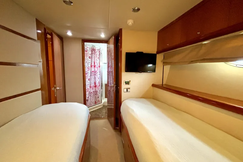 Slide: The Image of Luxurious cabin interior of 2005 Sunseeker 75 Yacht with twin beds and modern amenities. - 30