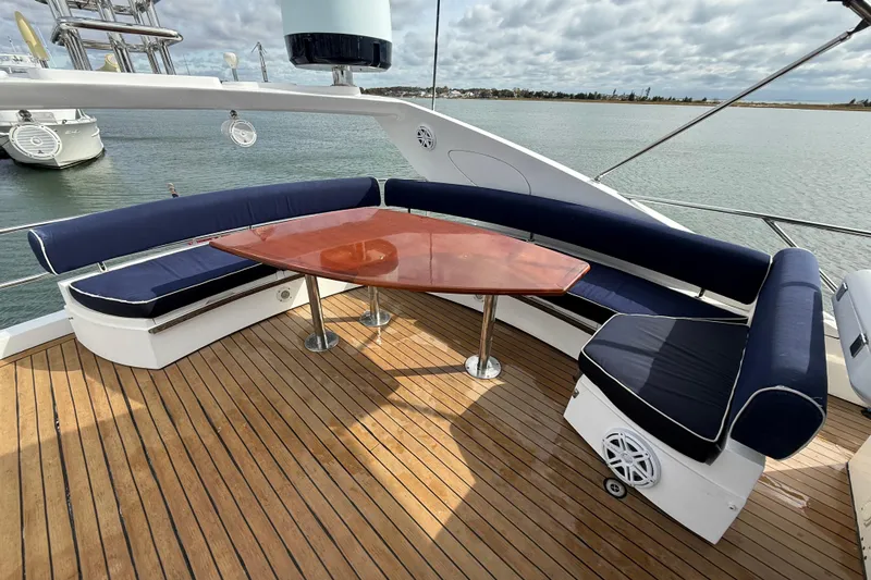 Slide: The Image of Luxurious 2005 Sunseeker 75 Yacht deck with elegant seating and wooden table. - 37