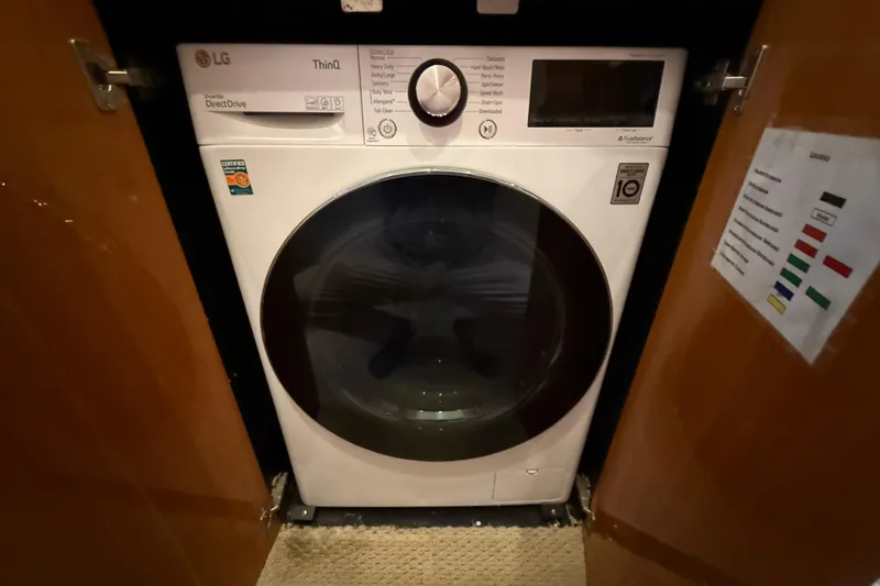 Slide: The Image of LG ThinQ washing machine in a 2005 Sunseeker 75 Yacht interior. - 41