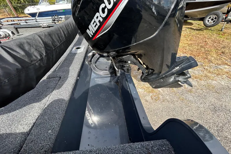 Slide: The Image of 2021 Lund 1675 Adventure SS boat with Mercury outboard motor, parked on a trailer. - 10