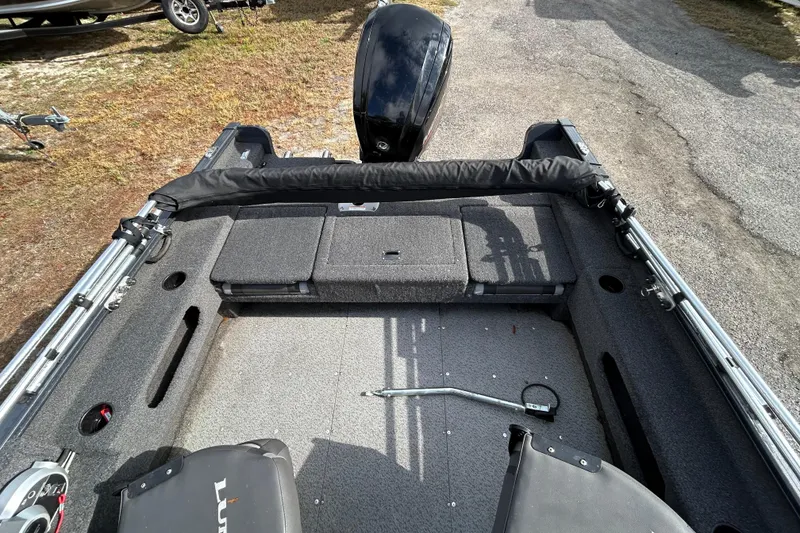 Slide: The Image of 2021 Lund 1675 Adventure SS boat interior with seating and storage compartments. - 17