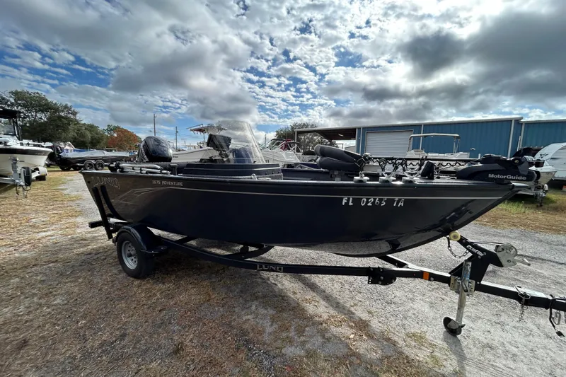 Slide: The Image of 2021 Lund 1675 Adventure SS boat on trailer under cloudy sky. - 4
