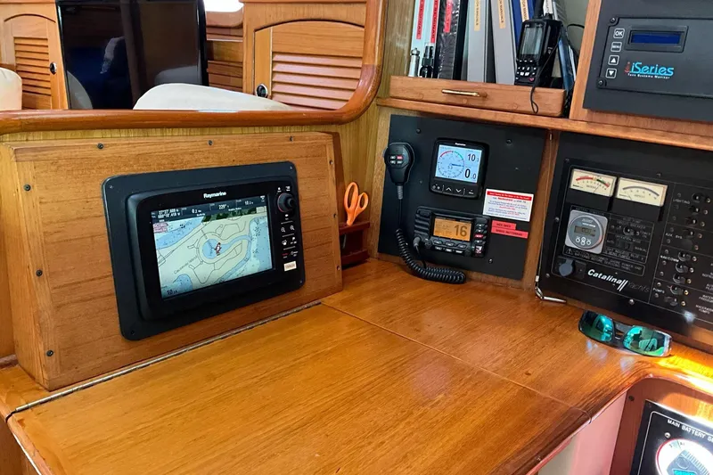 Slide: The Image of Navigation and control panel of a 2000 Catalina 470 yacht with electronic displays. - 12