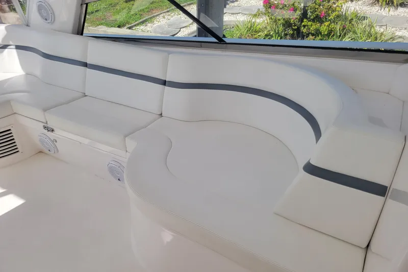 Slide: The Image of Luxurious seating area on 2016 Intrepid 475 Sport Yacht with white and gray upholstery. - 11