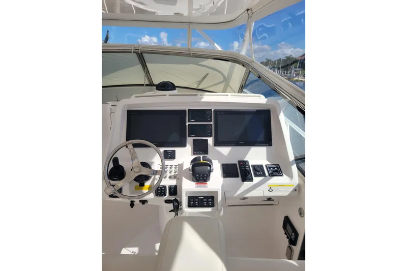 Slide: The Image of Helm of 2016 Intrepid 475 Sport Yacht with dual screens and controls. - 8