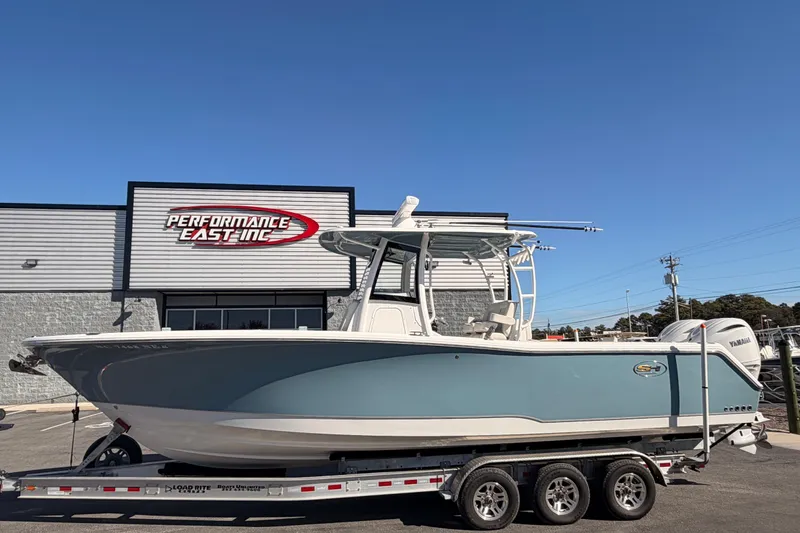 Slide: The Image of 2025 Sea Hunt Gamefish 30 Coffin Box boat on trailer at dealership. - 4