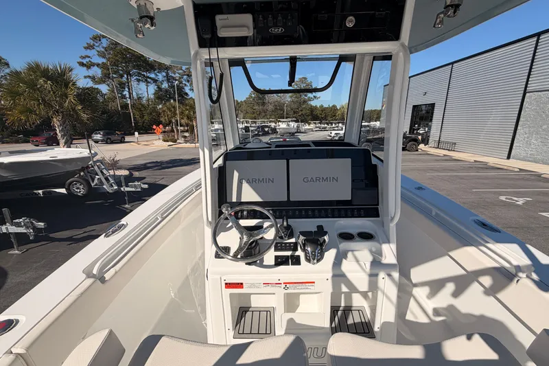 Slide: The Image of 2025 Sea Hunt Gamefish 30 Coffin Box boat cockpit with Garmin navigation system. - 6