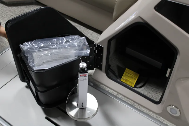 Slide: The Image of 2026 Premier 230 Sunsation Angler 2pt interior storage compartment with accessories. - 10