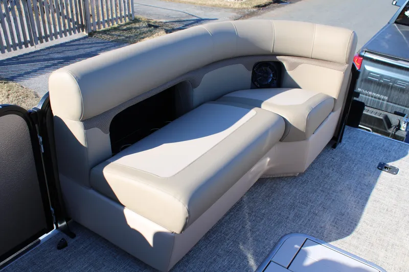 Slide: The Image of 2026 Premier 230 Sunsation Angler 2pt boat seating with beige upholstery and speaker. - 11