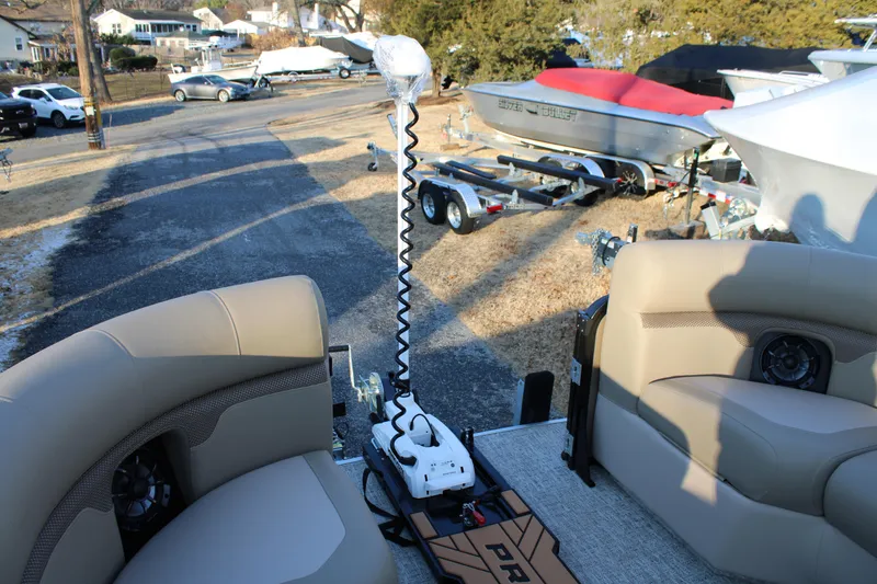 Slide: The Image of 2026 Premier 230 Sunsation Angler 2pt boat interior with seating and equipment. - 16