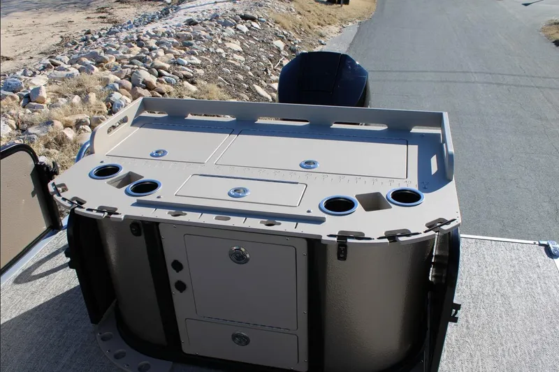 Slide: The Image of 2026 Premier 230 Sunsation Angler 2pt boat console with storage and cup holders. - 4