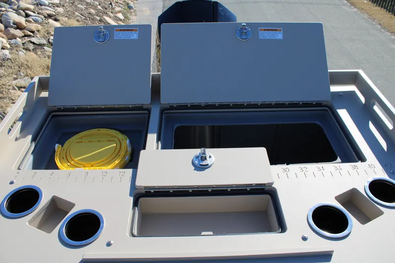 Slide: The Image of 2026 Premier 230 Sunsation Angler 2pt boat storage compartments and cup holders. - 6