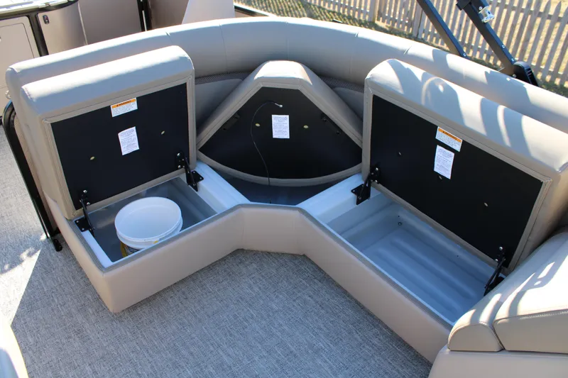 Slide: The Image of 2026 Premier 230 Sunsation Angler 2pt boat with open storage compartments. - 8