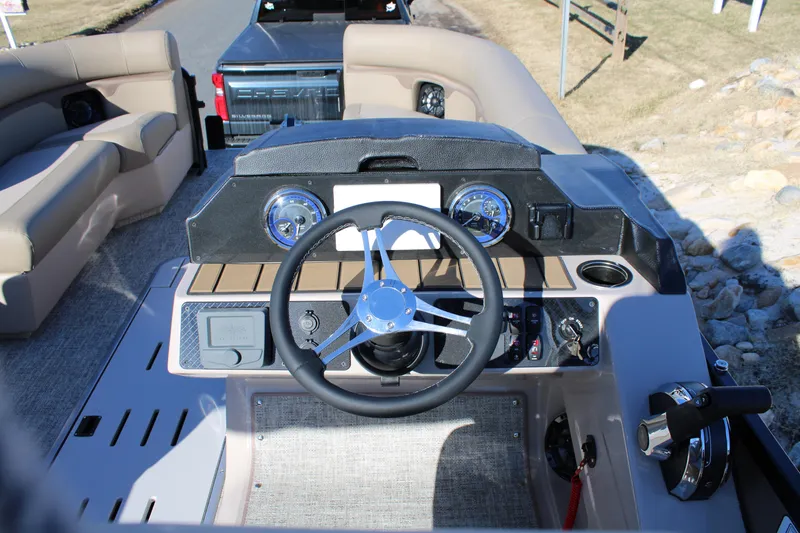 Slide: The Image of 2026 Premier 230 Sunsation Angler 2pt boat dashboard with steering wheel and controls. - 9