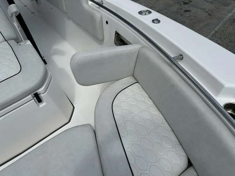 Slide: The Image of 2022 Sea Fox 288 Commander boat interior with cushioned seating and armrest detail. - 12