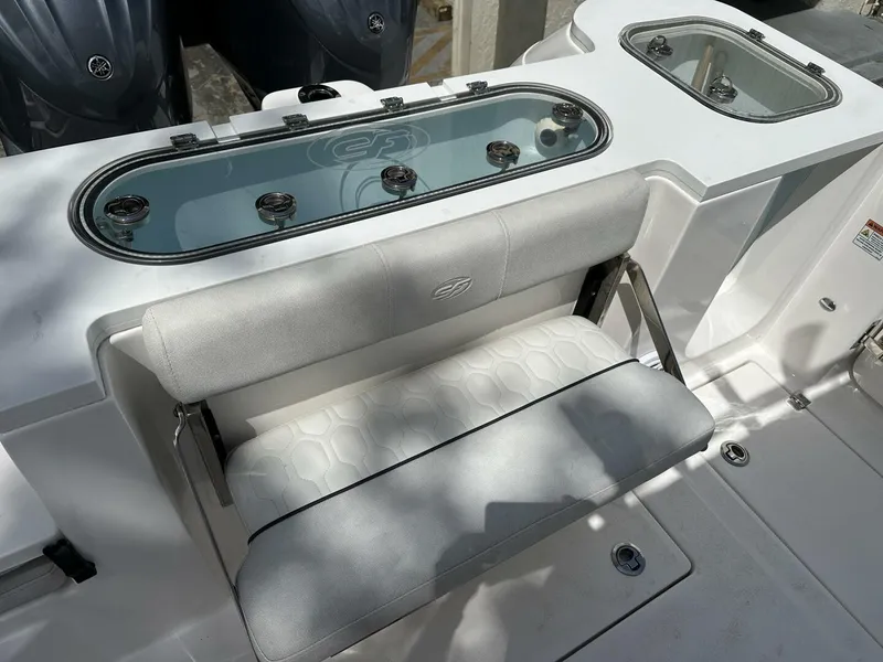Slide: The Image of 2022 Sea Fox 288 Commander boat seating and livewell area, featuring sleek design and functionality. - 18