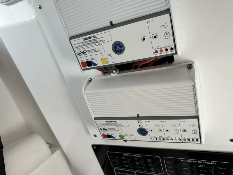 Slide: The Image of Control panel on a 2022 Sea Fox 288 Commander boat, featuring various switches and indicators. - 20