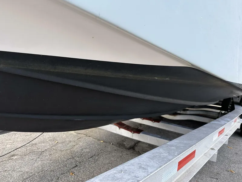 Slide: The Image of 2022 Sea Fox 288 Commander boat hull on a trailer, close-up view. - 7
