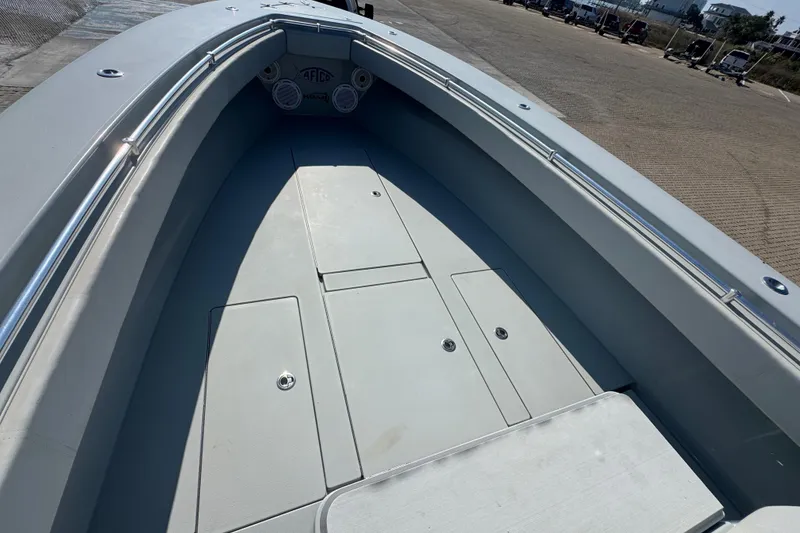 Slide: The Image of 2016 Contender 35 ST boat interior with storage compartments and sleek design. - 8
