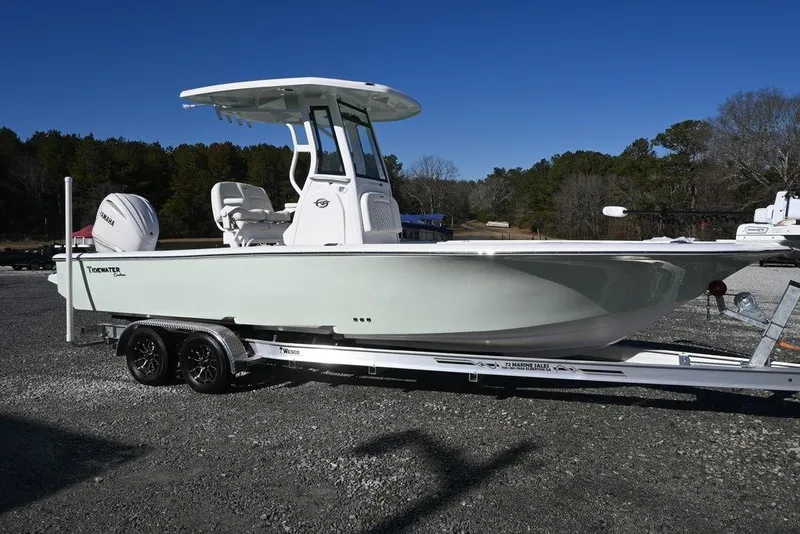 The Image of 2026 Tidewater 2500 Carolina Bay boat on trailer, outdoors, clear sky. - 1