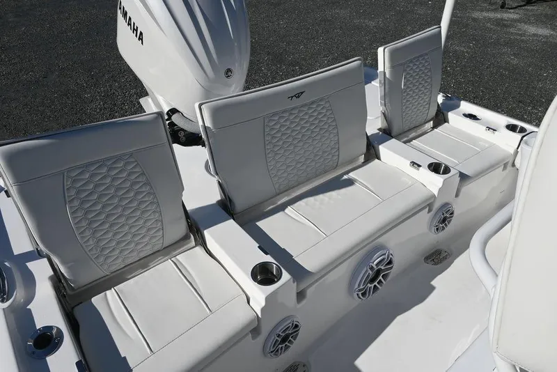 Slide: The Image of 2026 Tidewater 2500 Carolina Bay boat seats with Yamaha engine, featuring cup holders and speakers. - 12