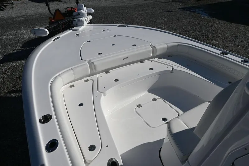 Slide: The Image of 2026 Tidewater 2500 Carolina Bay boat deck with seating and storage compartments. - 15