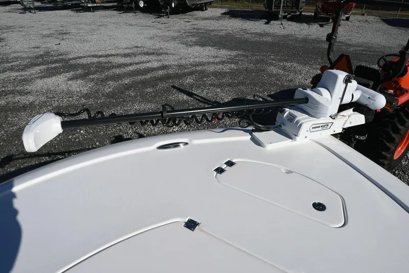 Slide: The Image of 2026 Tidewater 2500 Carolina Bay boat with Minn Kota trolling motor on deck. - 16