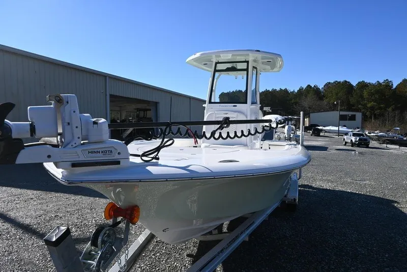 Slide: The Image of 2026 Tidewater 2500 Carolina Bay boat with Minn Kota motor in outdoor setting. - 8