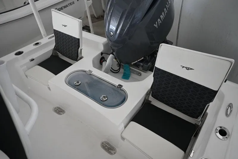 Slide: The Image of 2026 Tidewater 2110 Bay Max boat interior with Yamaha engine and seating. - 13