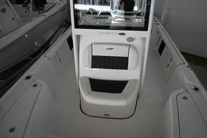 Slide: The Image of 2026 Tidewater 2110 Bay Max boat interior with seating and console design. - 15