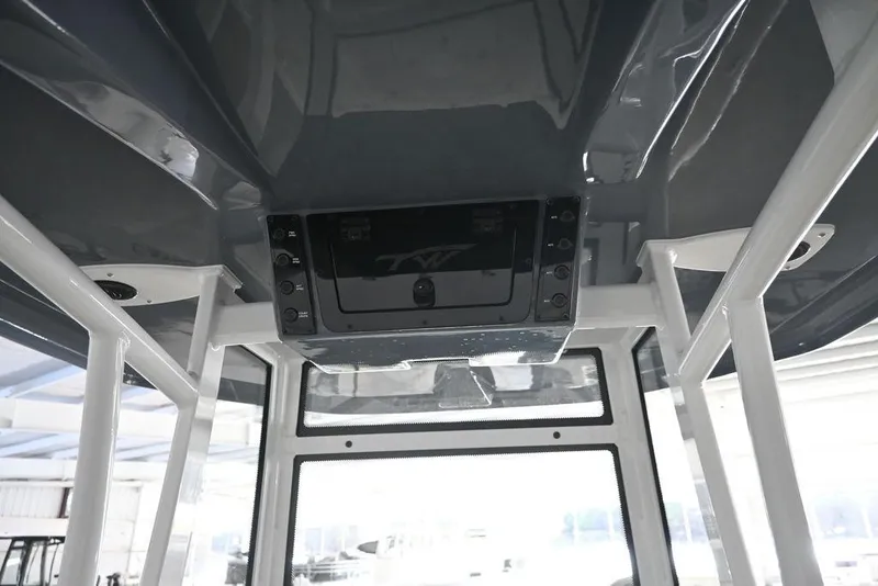 Slide: The Image of 2026 Tidewater 2110 Bay Max boat interior with modern console design. - 7